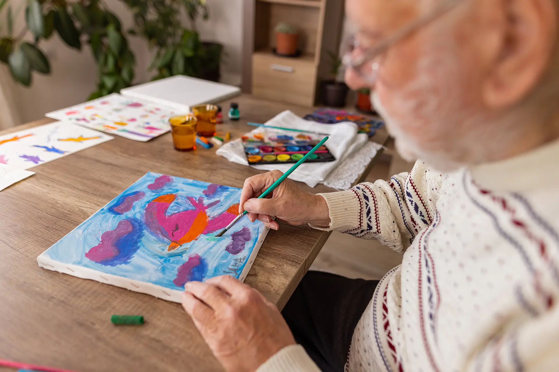 Senior man painting